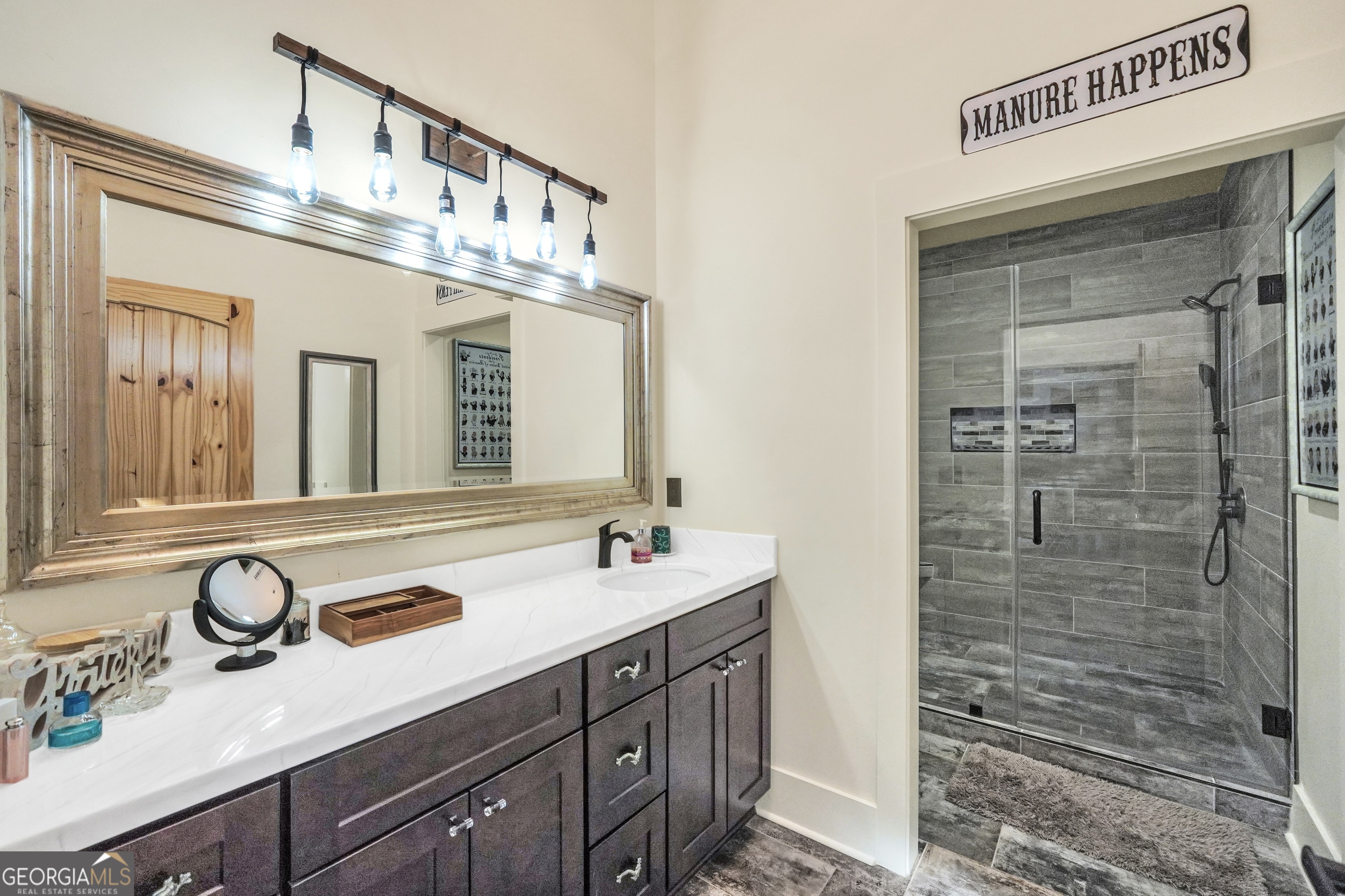 616 Shackelford Road Griffin, GA 30224 - Photo 38 of 64 a bathroom with a sink double vanity and a mirror