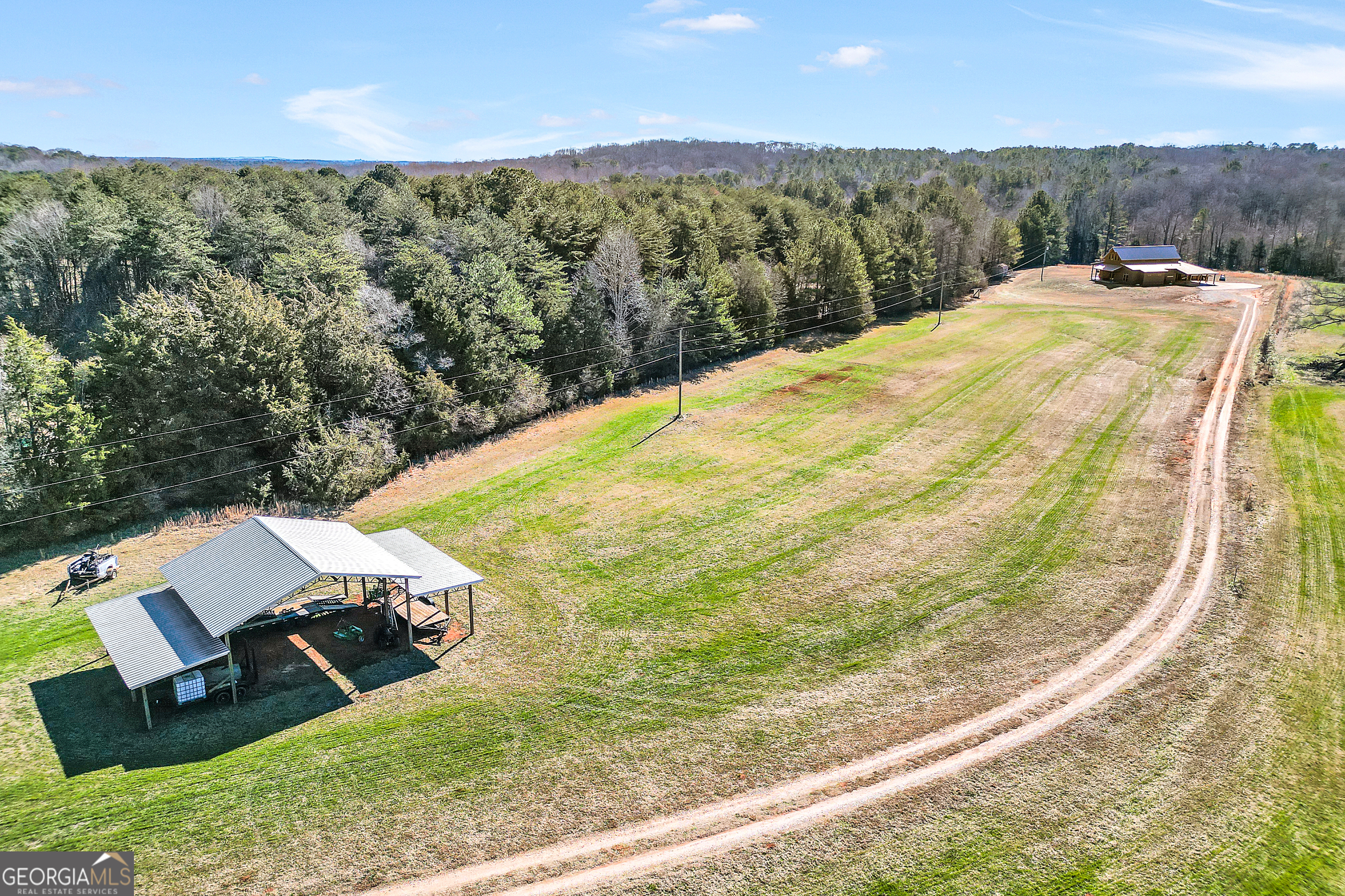 616 Shackelford Road Griffin, GA 30224 - Photo 5 of 64 a view of a backyard with couches under an umbrella