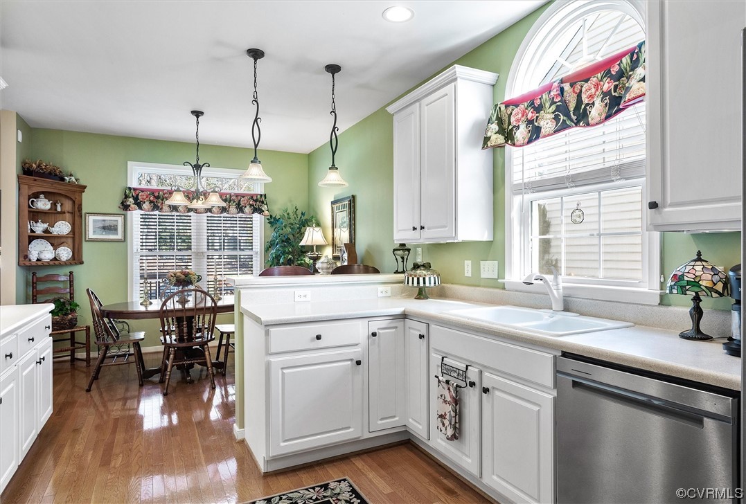 9508 Meadowview Road Henrico, VA 23294 - Photo 11 of 34 a kitchen with a sink cabinets and wooden floor
