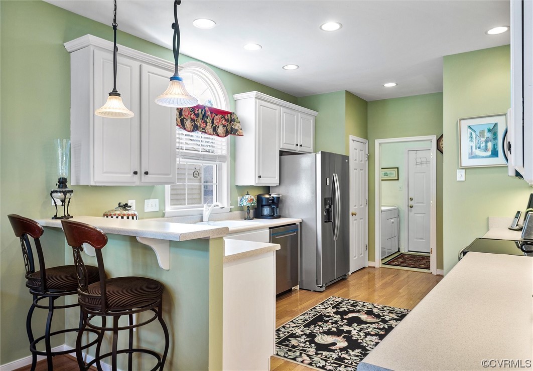 9508 Meadowview Road Henrico, VA 23294 - Photo 12 of 34 a kitchen with stainless steel appliances granite countertop a sink and a refrigerator