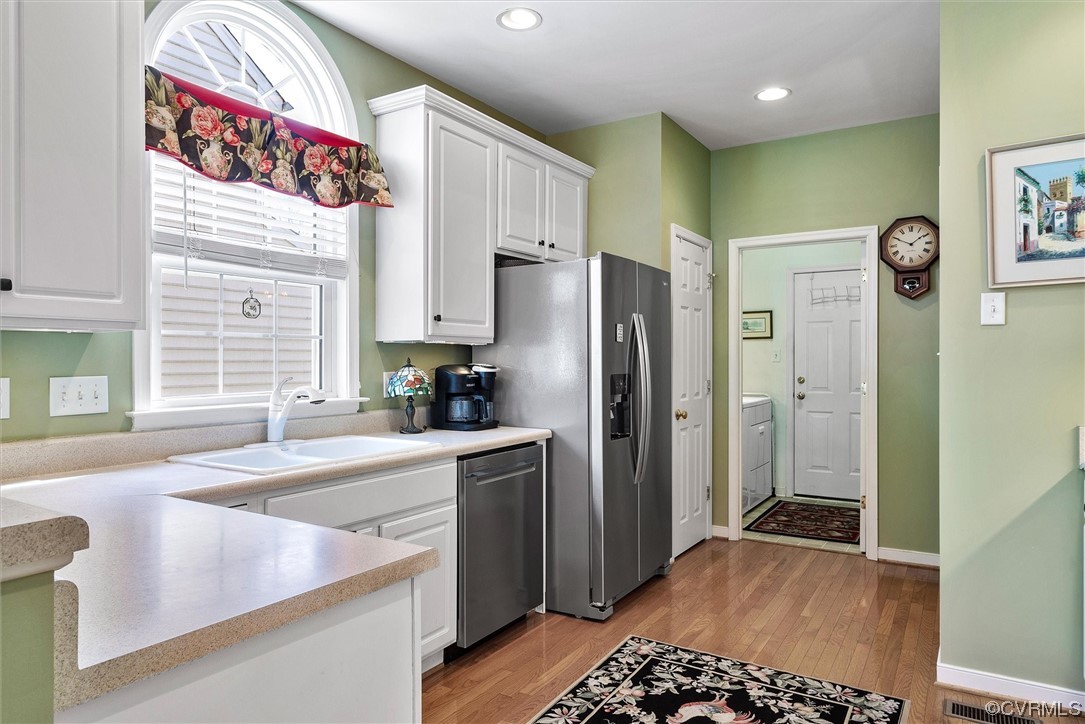 9508 Meadowview Road Henrico, VA 23294 - Photo 15 of 34 a kitchen with stainless steel appliances granite countertop a refrigerator and a sink