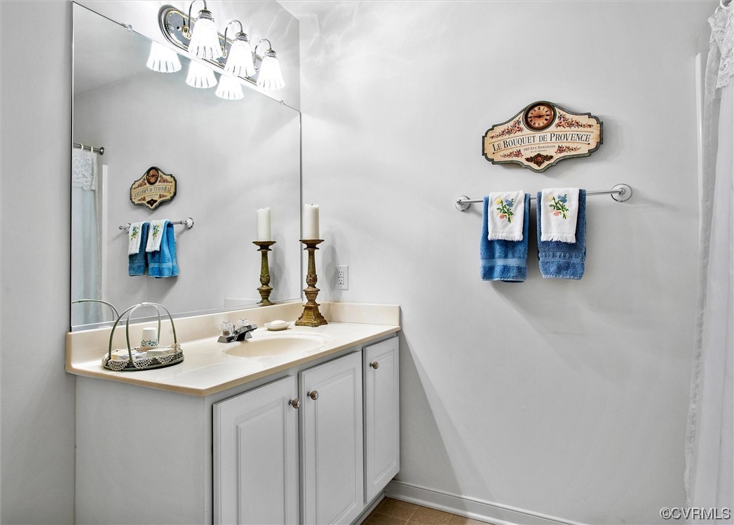 9508 Meadowview Road Henrico, VA 23294 - Photo 23 of 34 a bathroom with a sink and a mirror