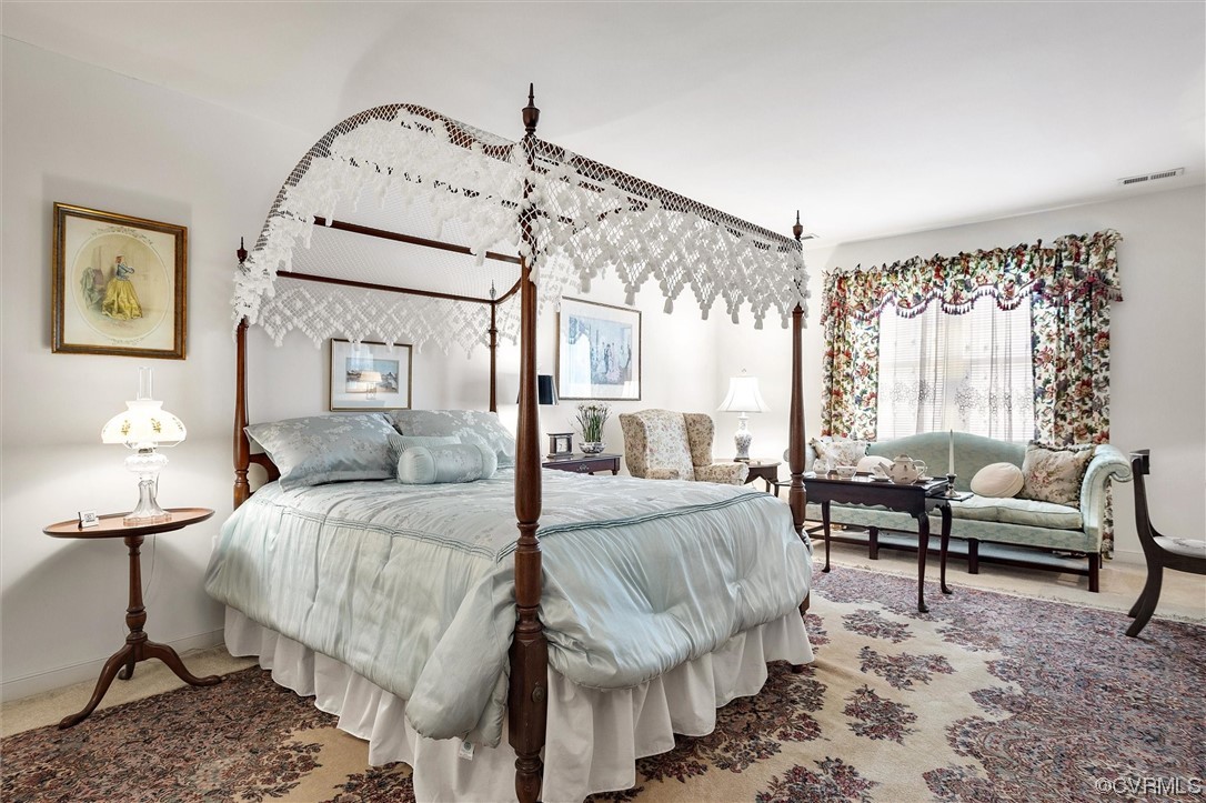 9508 Meadowview Road Henrico, VA 23294 - Photo 27 of 34 a spacious bedroom with a bed a couch and dresser