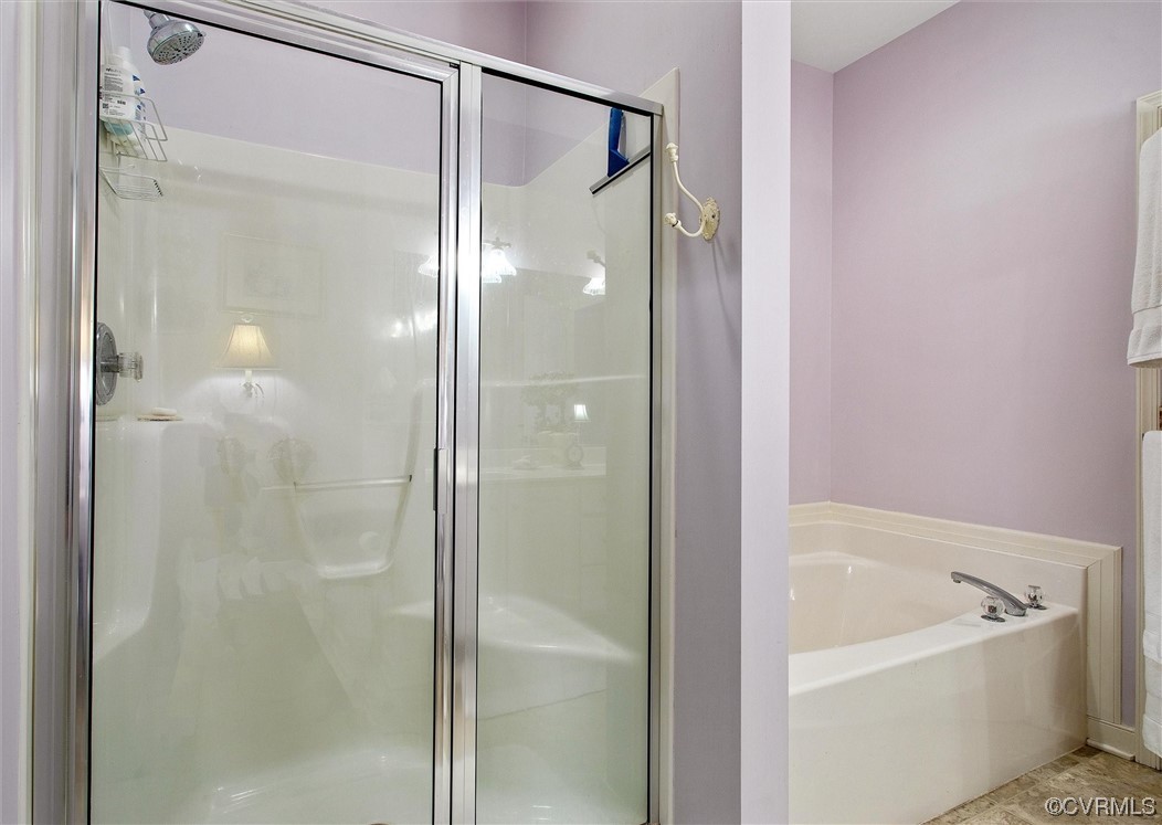 9508 Meadowview Road Henrico, VA 23294 - Photo 30 of 34 a bathroom with a bathtub and a shower