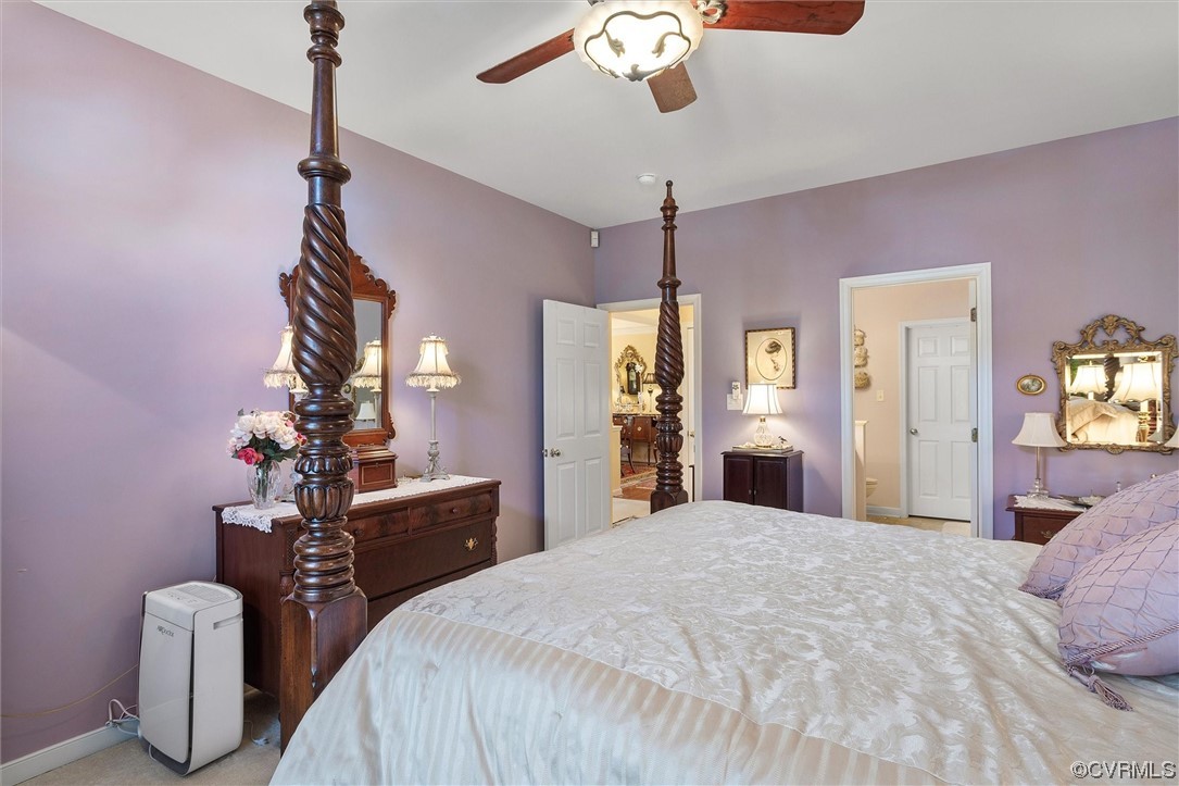 9508 Meadowview Road Henrico, VA 23294 - Photo 33 of 34 a bedroom with a bed and a chandelier