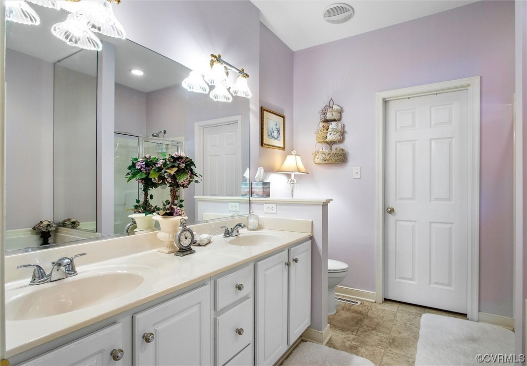9508 Meadowview Road Henrico, VA 23294 - Photo 34 of 34 a bathroom with a sink double vanity and a mirror