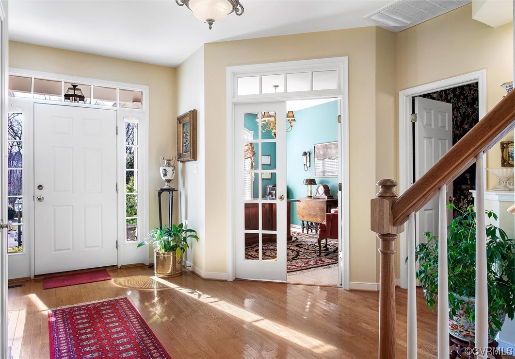 9508 Meadowview Road Henrico, VA 23294 - Photo 4 of 34 a view of an entryway with wooden floor and windows