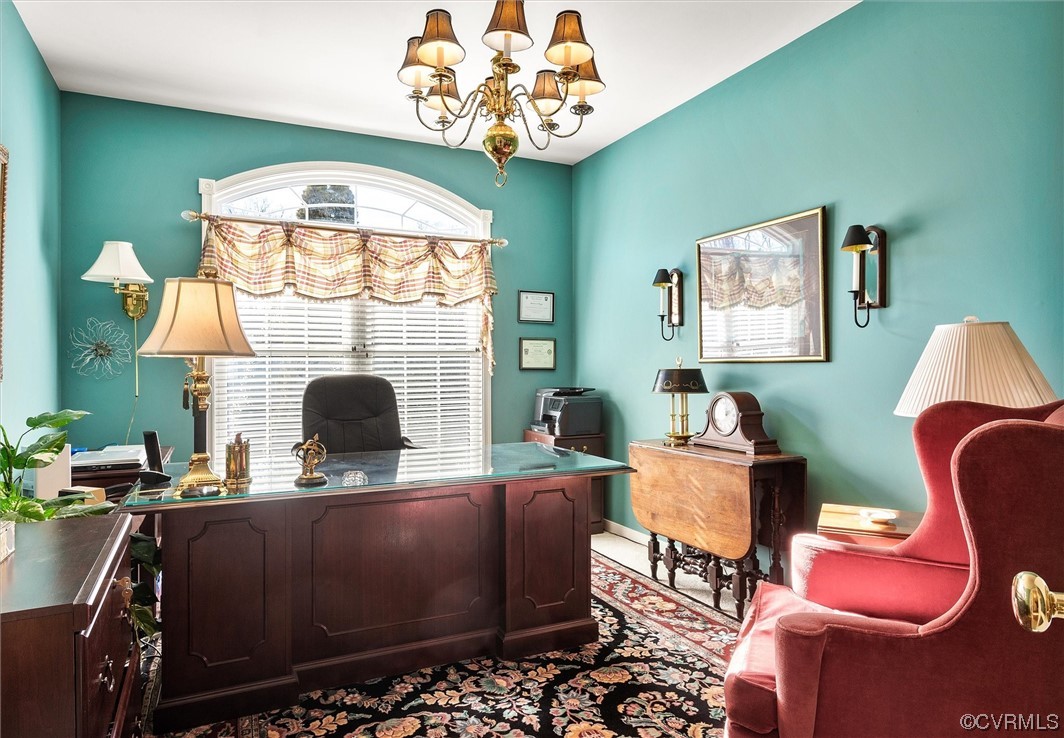 9508 Meadowview Road Henrico, VA 23294 - Photo 6 of 34 a living room with furniture a fireplace and a chandelier