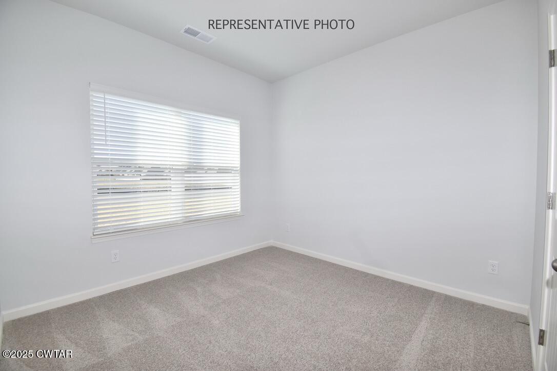 108 Gateway Drive Jackson, TN 38305 - Photo 16 of 19 a view of an empty room with a window