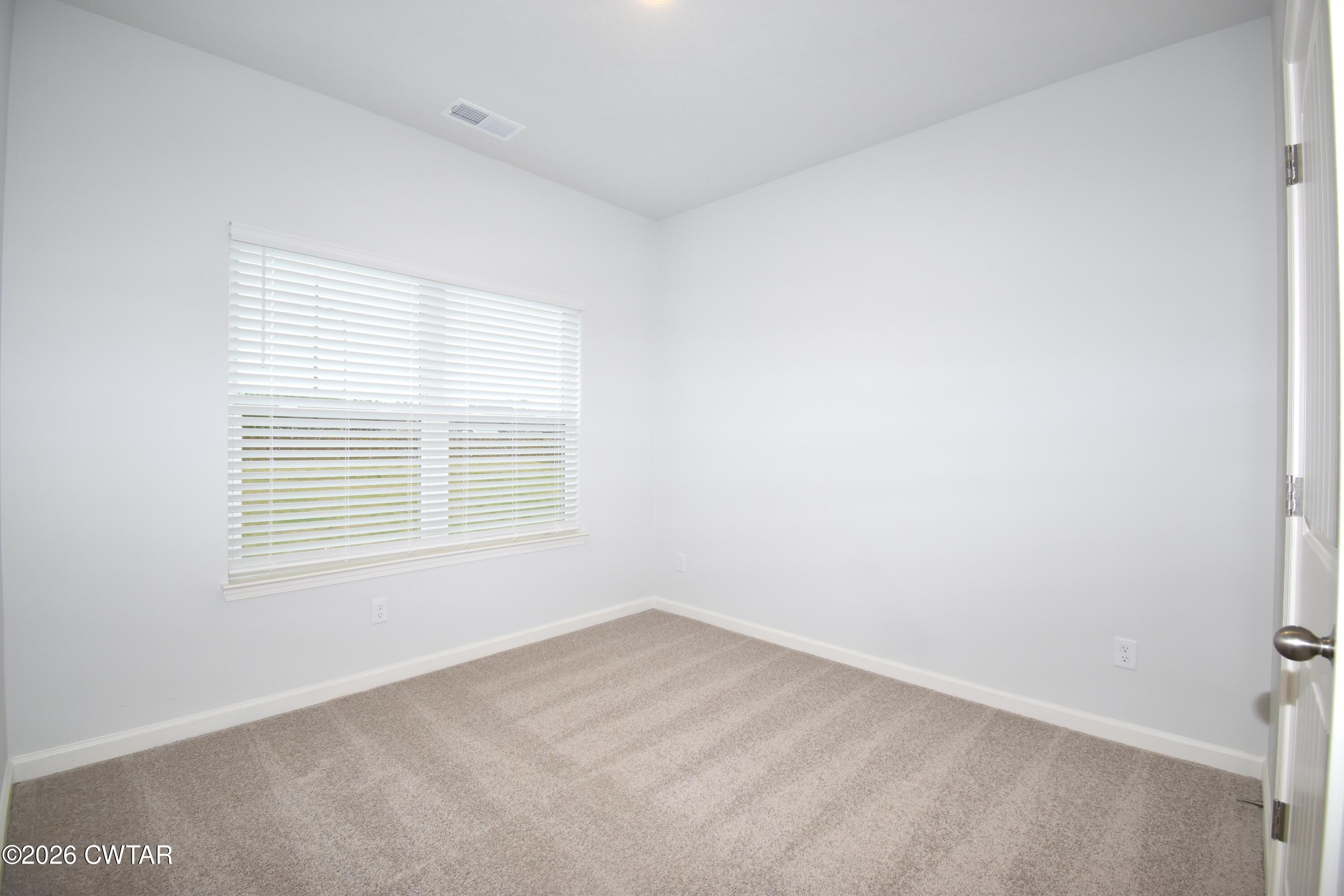 108 Gateway Drive Jackson, TN 38305 - Photo 17 of 21 a view of an empty room with a window