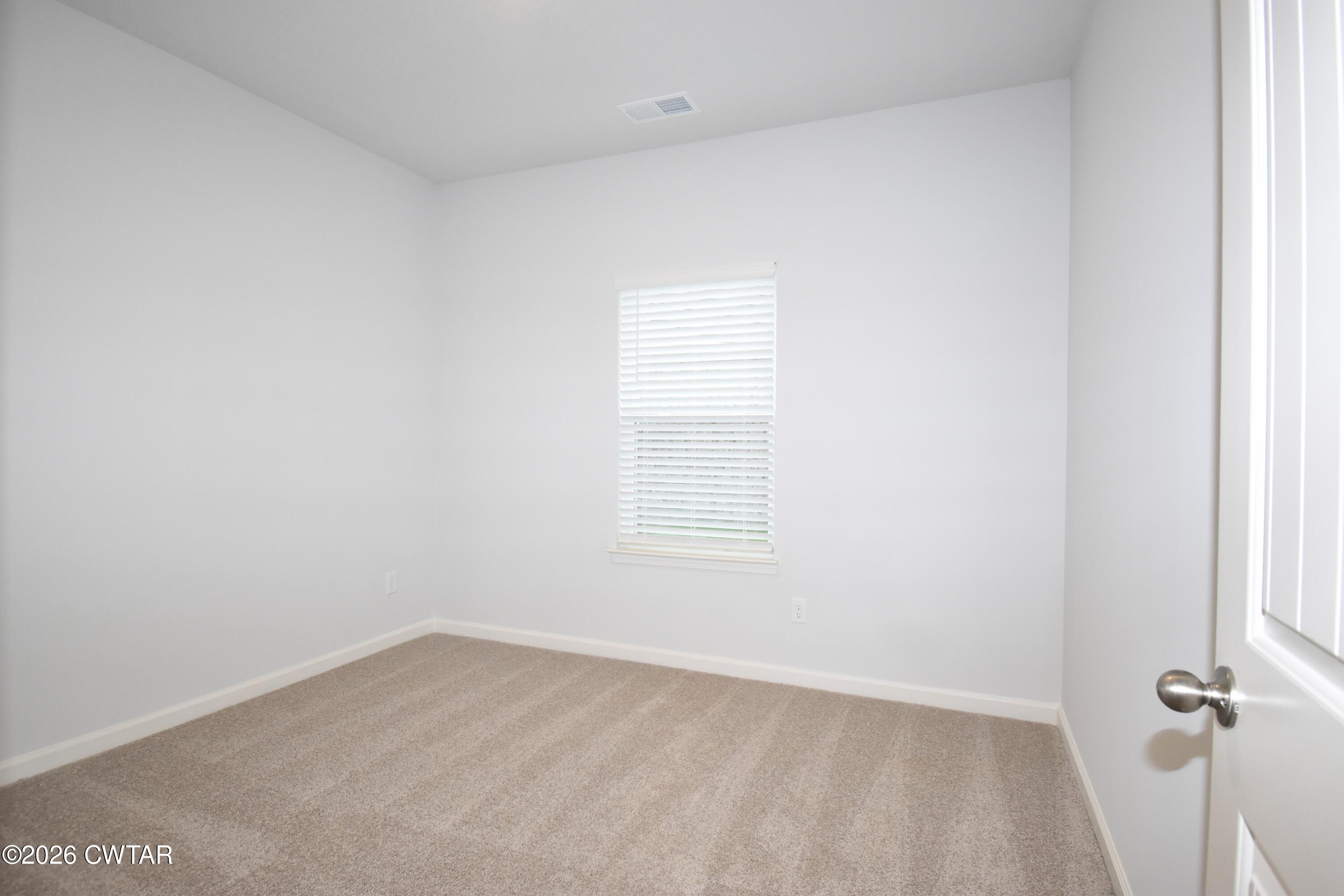 108 Gateway Drive Jackson, TN 38305 - Photo 19 of 21 an empty room with a window