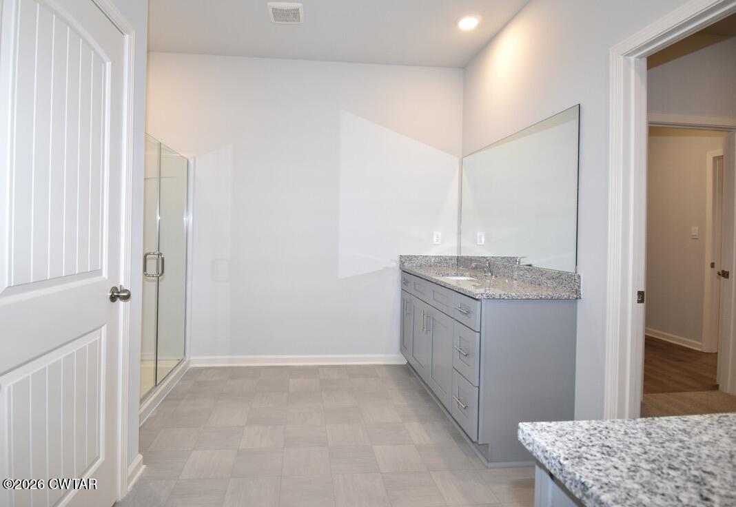 108 Gateway Drive Jackson, TN 38305 - Photo 10 of 21 a bathroom with a granite countertop sink and a mirror