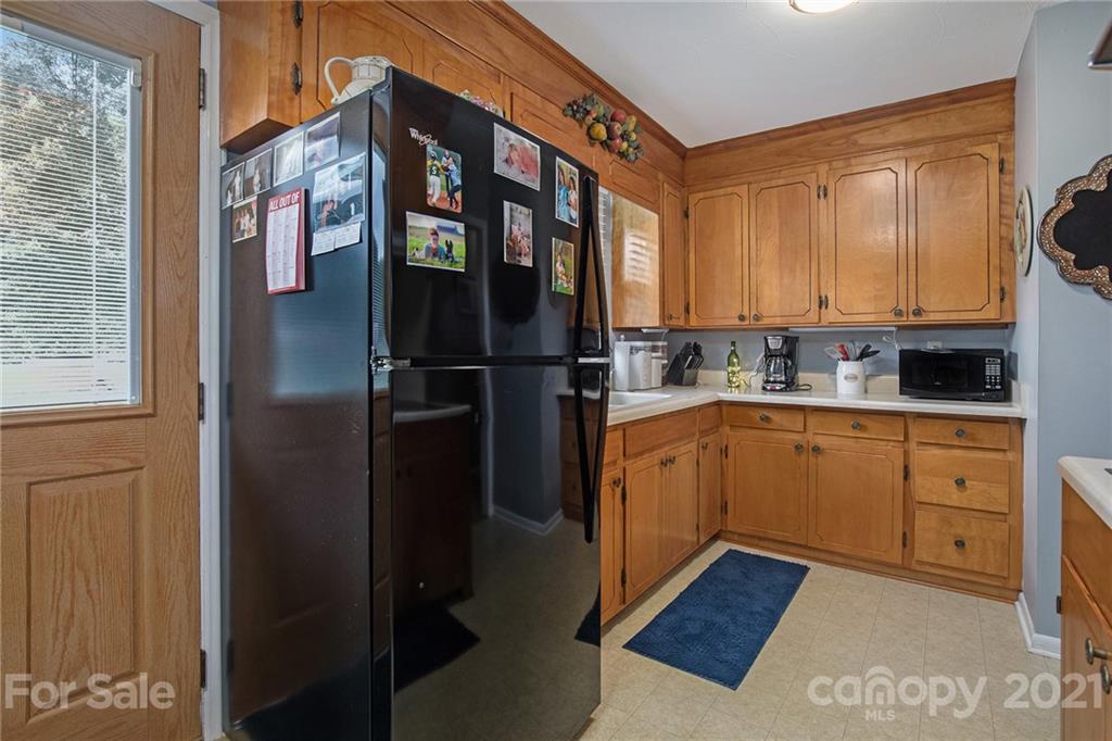4025 Fallston Road Shelby, NC 28150 - Photo 13 of 29 a kitchen with stainless steel appliances granite countertop a refrigerator a stove a sink and dishwasher with a dishwasher