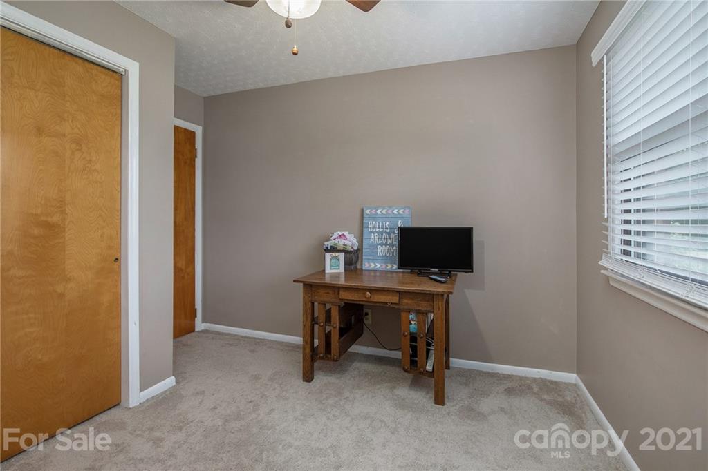 4025 Fallston Road Shelby, NC 28150 - Photo 18 of 29 a view of a workspace with furniture and a window