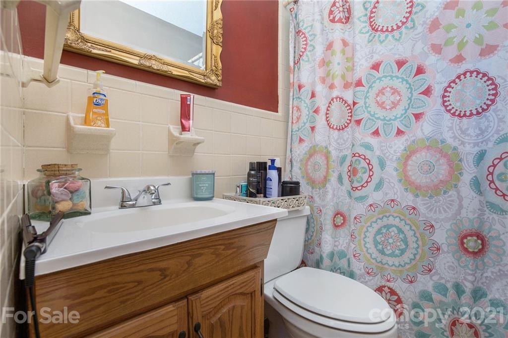 4025 Fallston Road Shelby, NC 28150 - Photo 24 of 29 a bathroom with a sink toilet and vanity