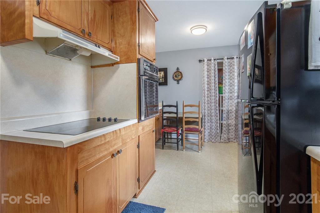 4025 Fallston Road Shelby, NC 28150 - Photo 10 of 29 a kitchen with stainless steel appliances granite countertop a refrigerator and a sink