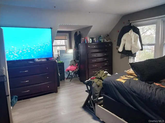 a room with furniture and a flat screen tv