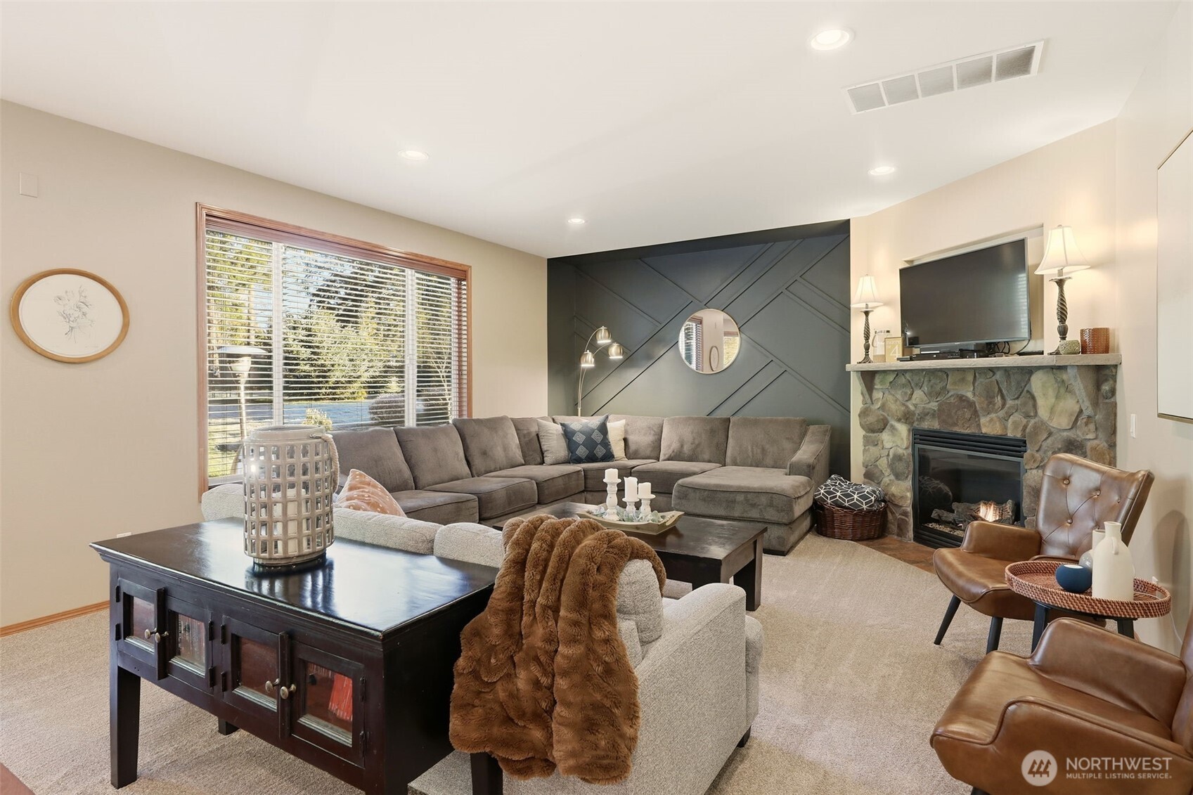 13621 3rd Street Southeast Snohomish, WA 98290 - Photo 13 of 38 a living room with furniture a fireplace and a flat screen tv