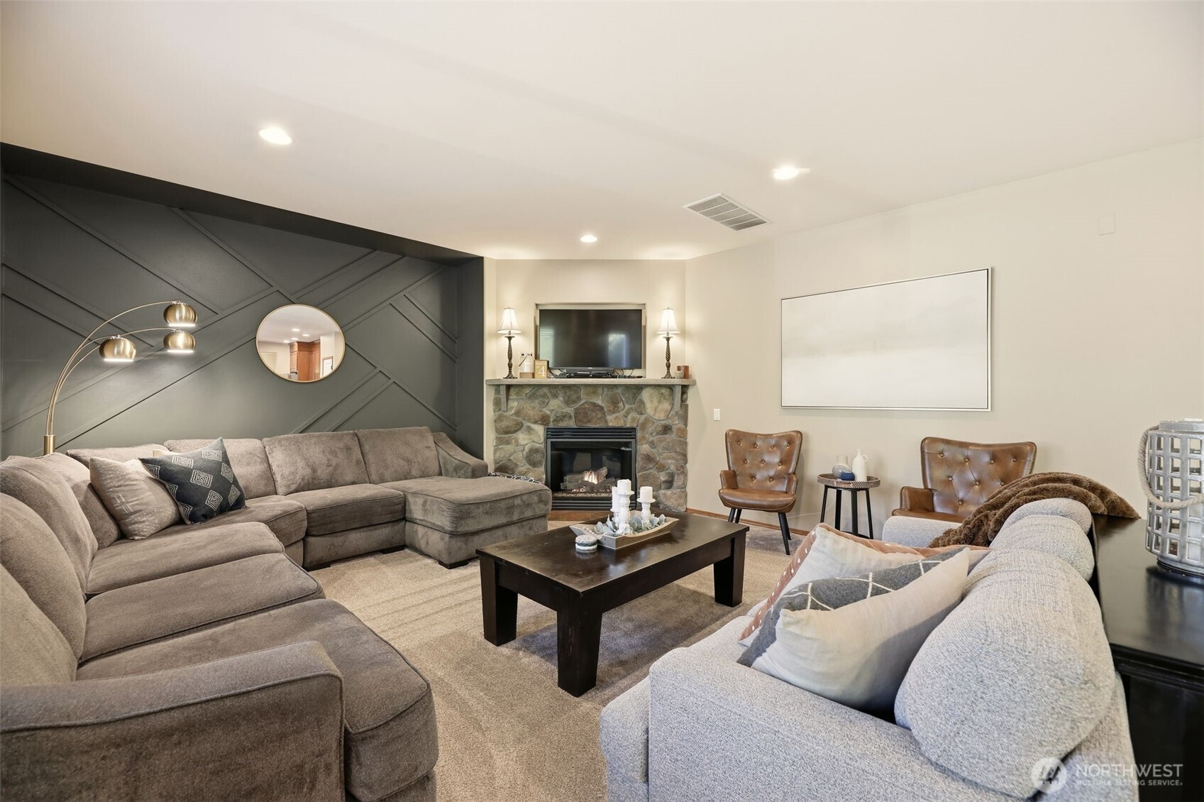 13621 3rd Street Southeast Snohomish, WA 98290 - Photo 14 of 38 a living room with furniture a fireplace and a flat screen tv