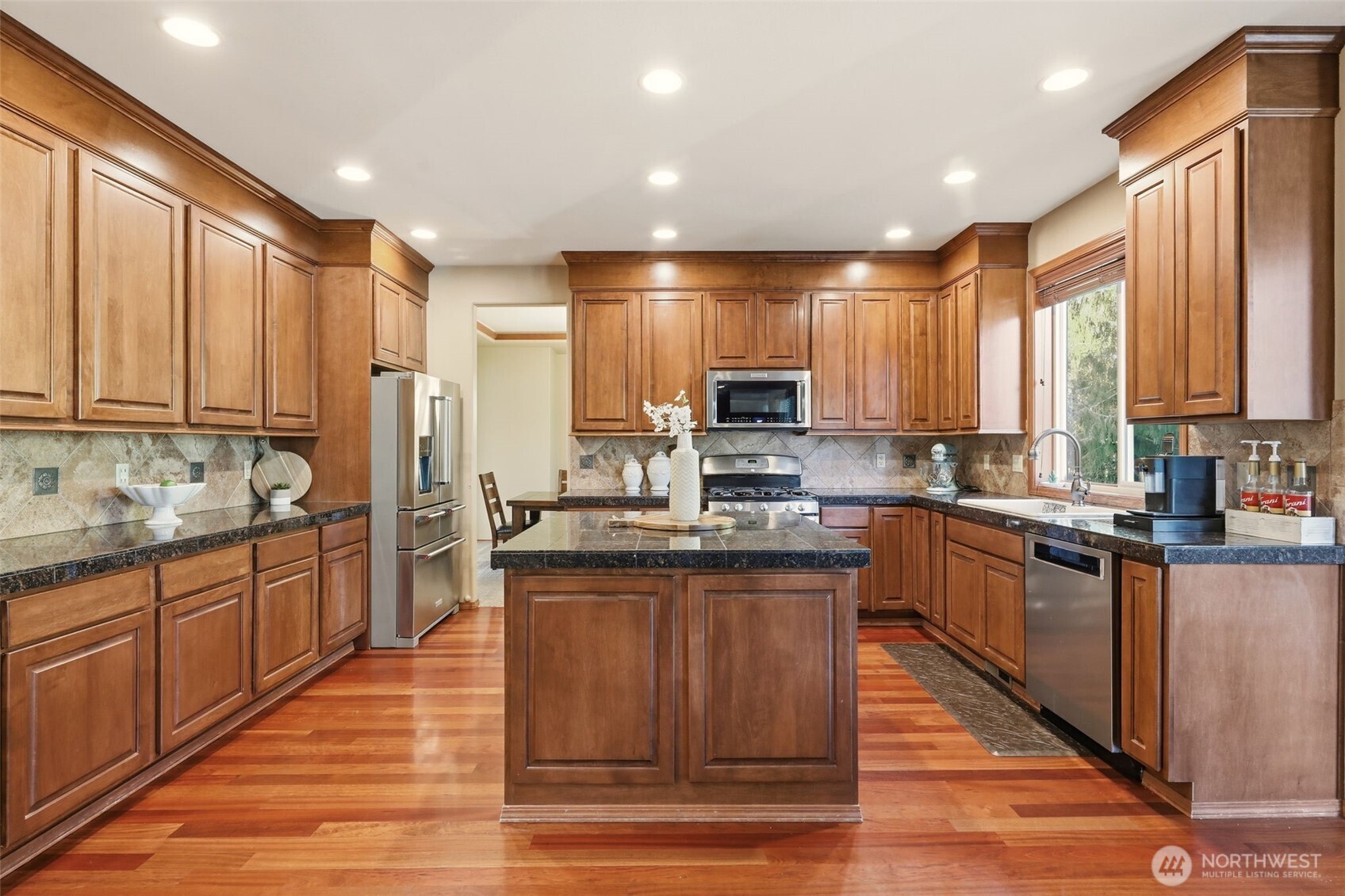 13621 3rd Street Southeast Snohomish, WA 98290 - Photo 10 of 38 a kitchen with stainless steel appliances granite countertop refrigerator a sink dishwasher stove and oven