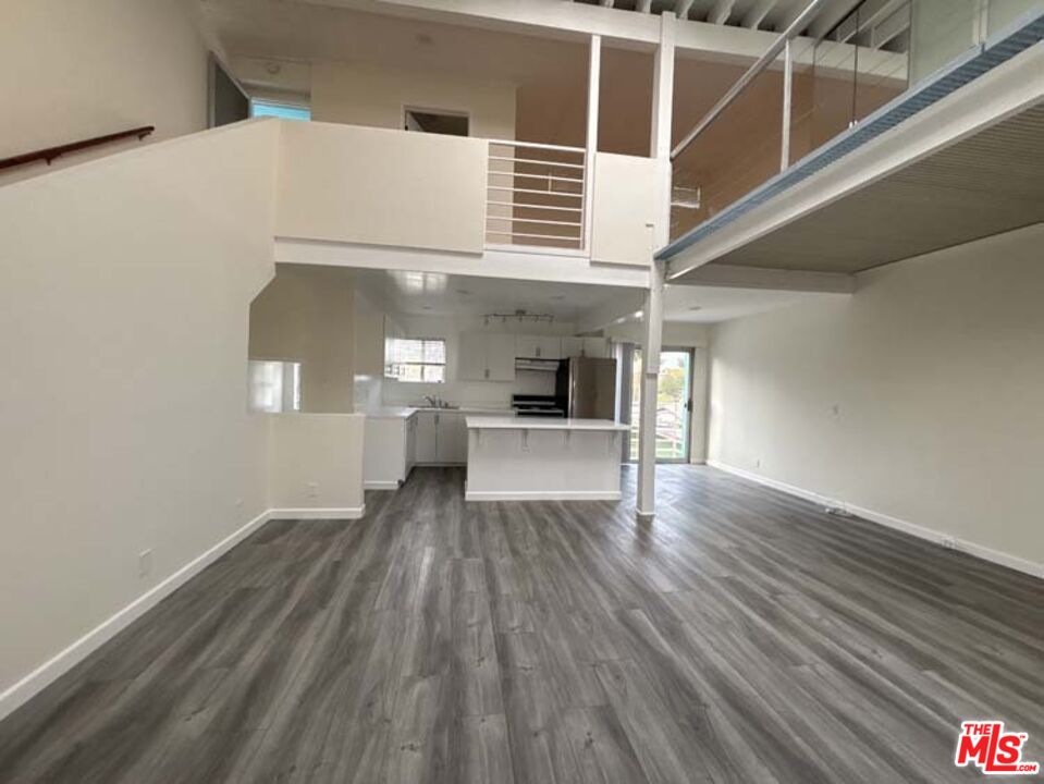 915 Broadway Street, Unit 2 Venice, CA 90291 - Photo 20 of 31 a view of a hallway with wooden floor and staircase