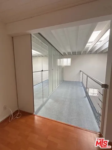 a view of an empty room with stairs