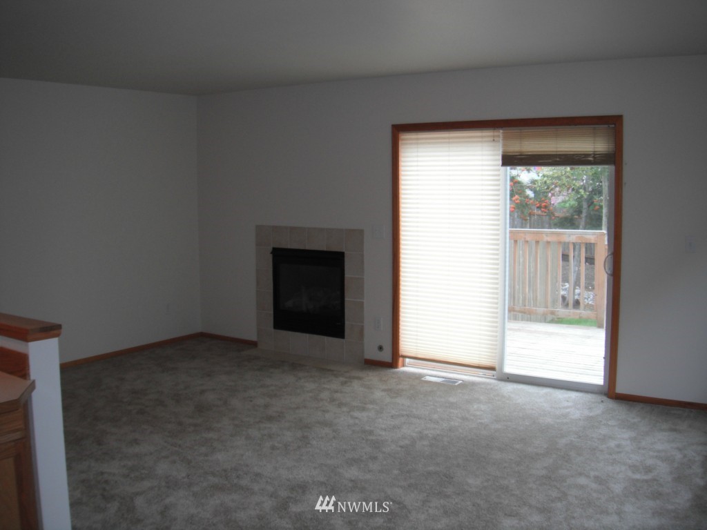 7522 Lower Ridge Road Everett, WA 98203 - Photo 3 of 6 a view of an empty room with a window