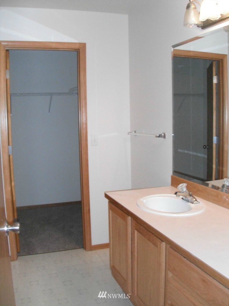 7522 Lower Ridge Road Everett, WA 98203 - Photo 5 of 6 a bathroom with a sink and a mirror