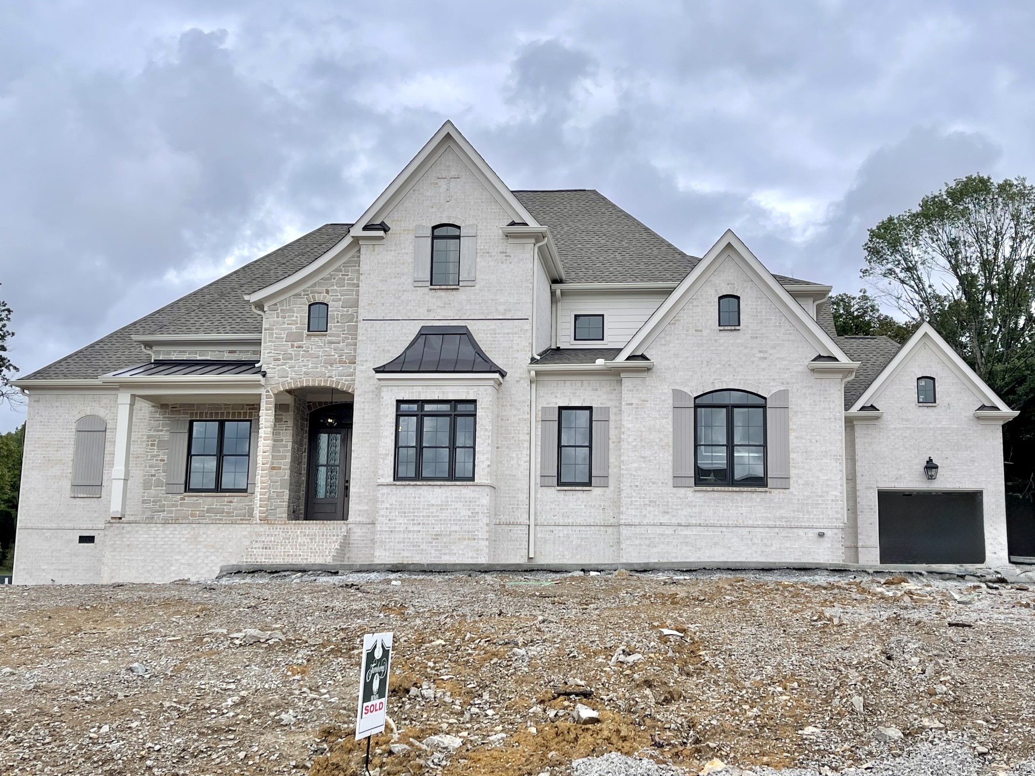 9908 Elland Road Brentwood, TN 37027 - Photo 1 of 1 a view of a large white house with large windows
