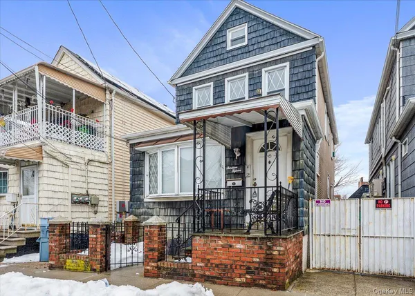 a front view of a house with glass windows