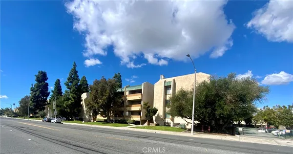 a view of a building with a street