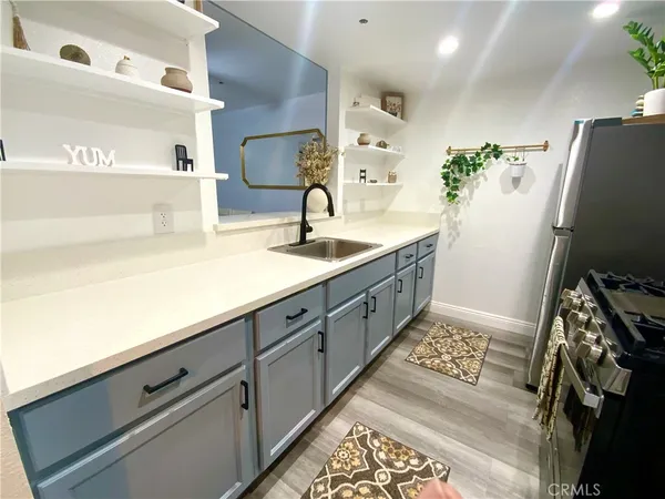 a spacious bathroom with a sink and mirror