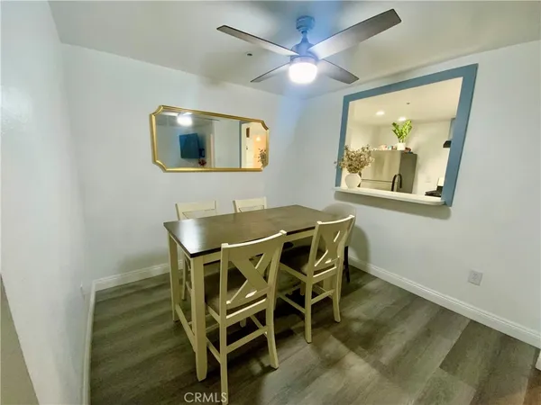 a dining room with furniture and a window