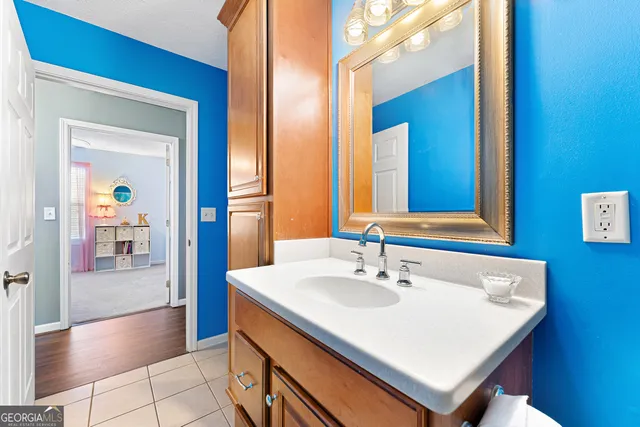 a bathroom with a sink a mirror and a bathtub