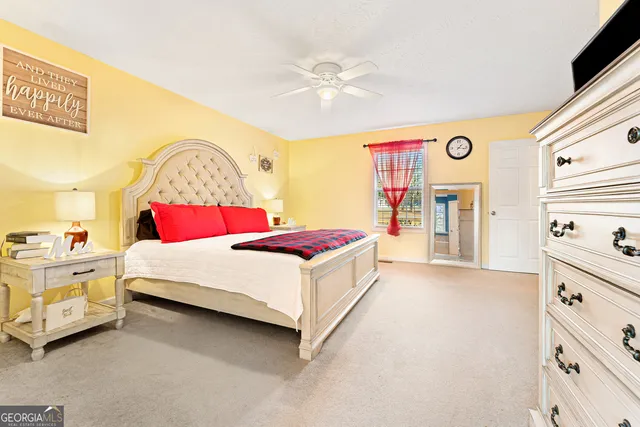 a bed room with a bed and a dresser