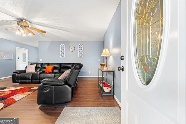 a living room with furniture and a table