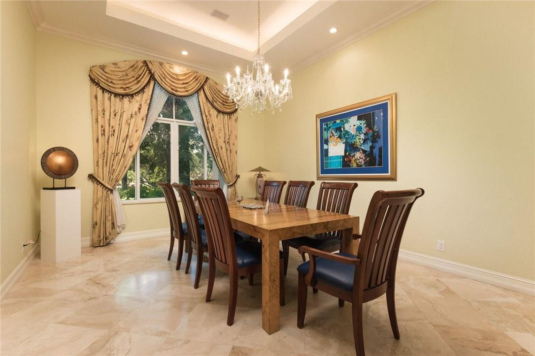 17611 Southwest 48th Street Southwest Ranches, FL 33331 - Photo 10 of 55 a view of a dining room with furniture and a chandelier