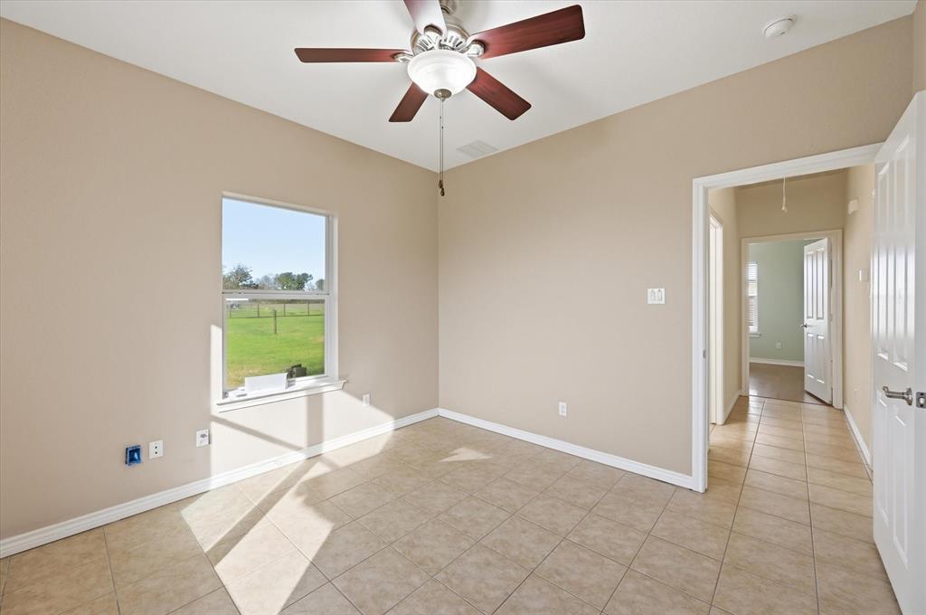 1616 Nash-Howard Road Waxahachie, TX 75165 - Photo 29 of 36 a view of a livingroom with a ceiling fan and chandelier fan