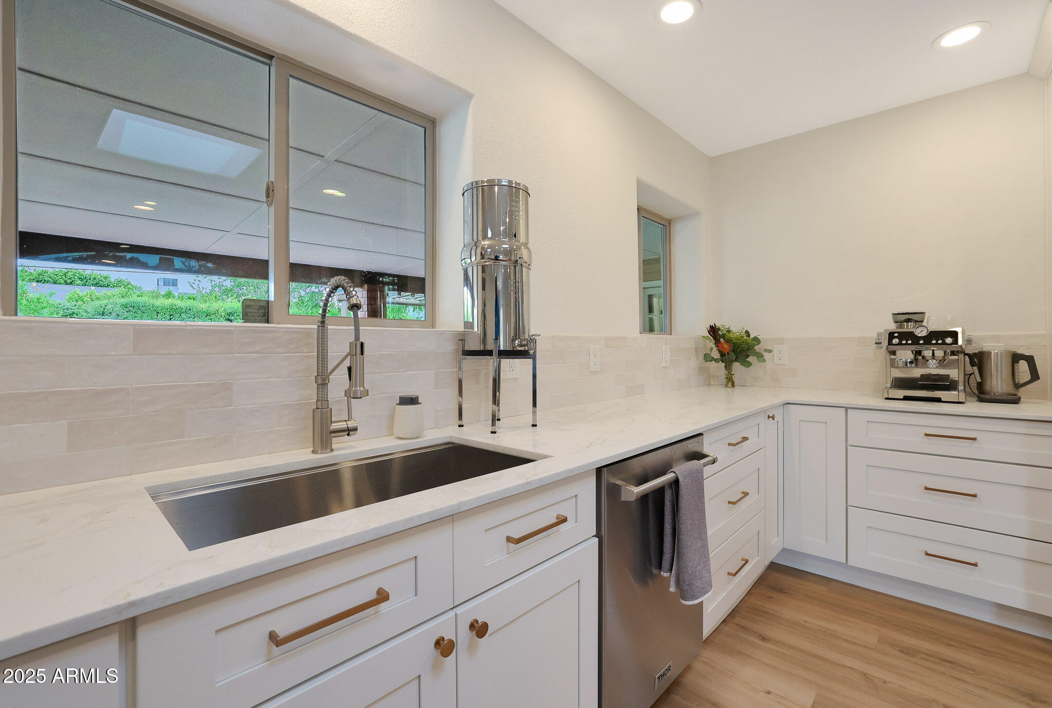 2226 East Fairmount Avenue Phoenix, AZ 85016 - Photo 11 of 50 a kitchen with a sink and cabinets