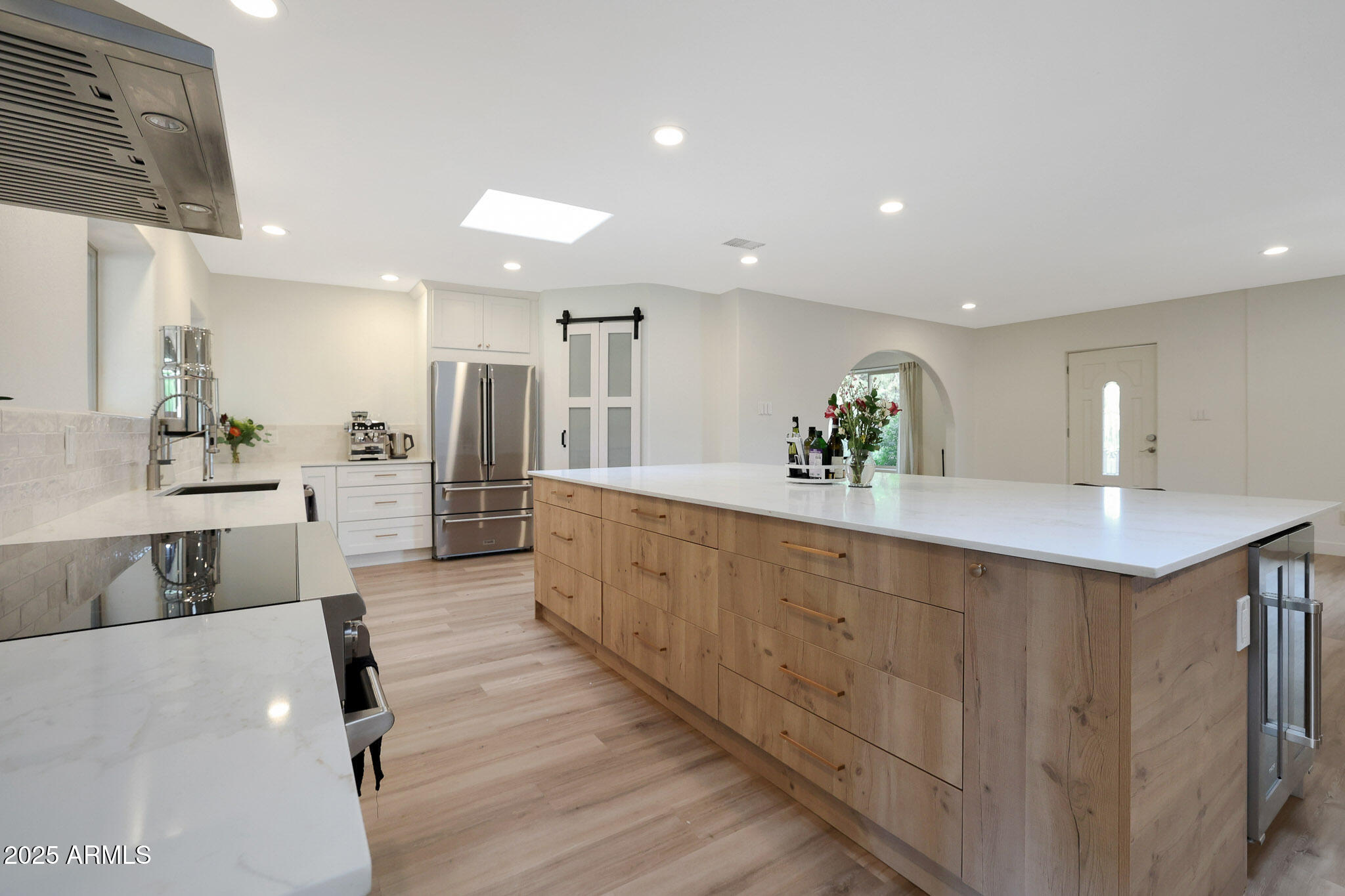 2226 East Fairmount Avenue Phoenix, AZ 85016 - Photo 13 of 50 a large kitchen with kitchen island a counter top space a sink and stainless steel appliances