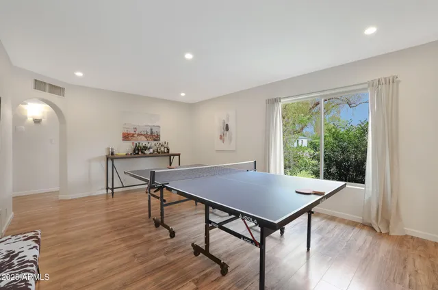 a view of a dining room with furniture and wooden floor