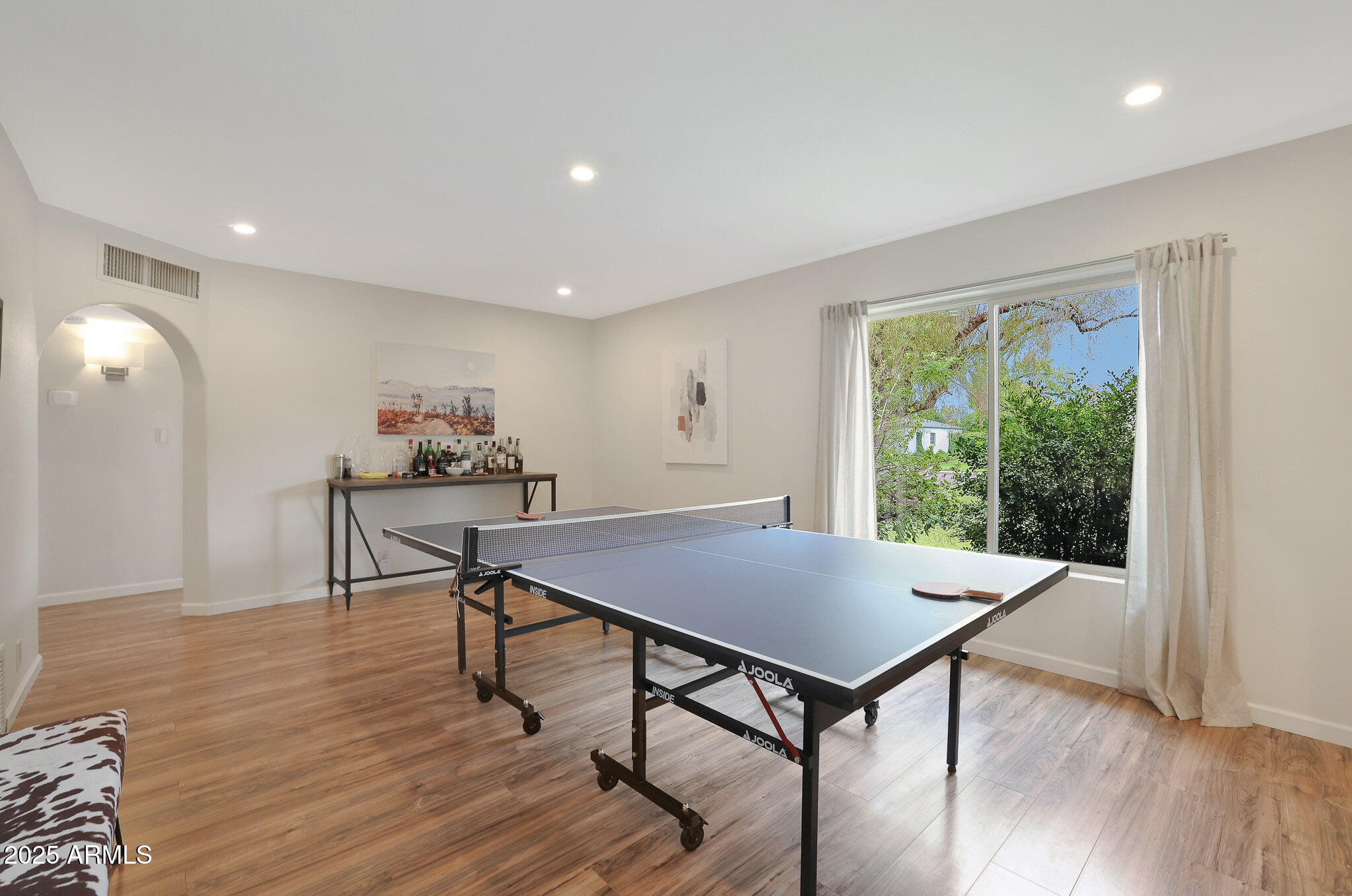 2226 East Fairmount Avenue Phoenix, AZ 85016 - Photo 22 of 50 a view of a workspace with furniture and wooden floor