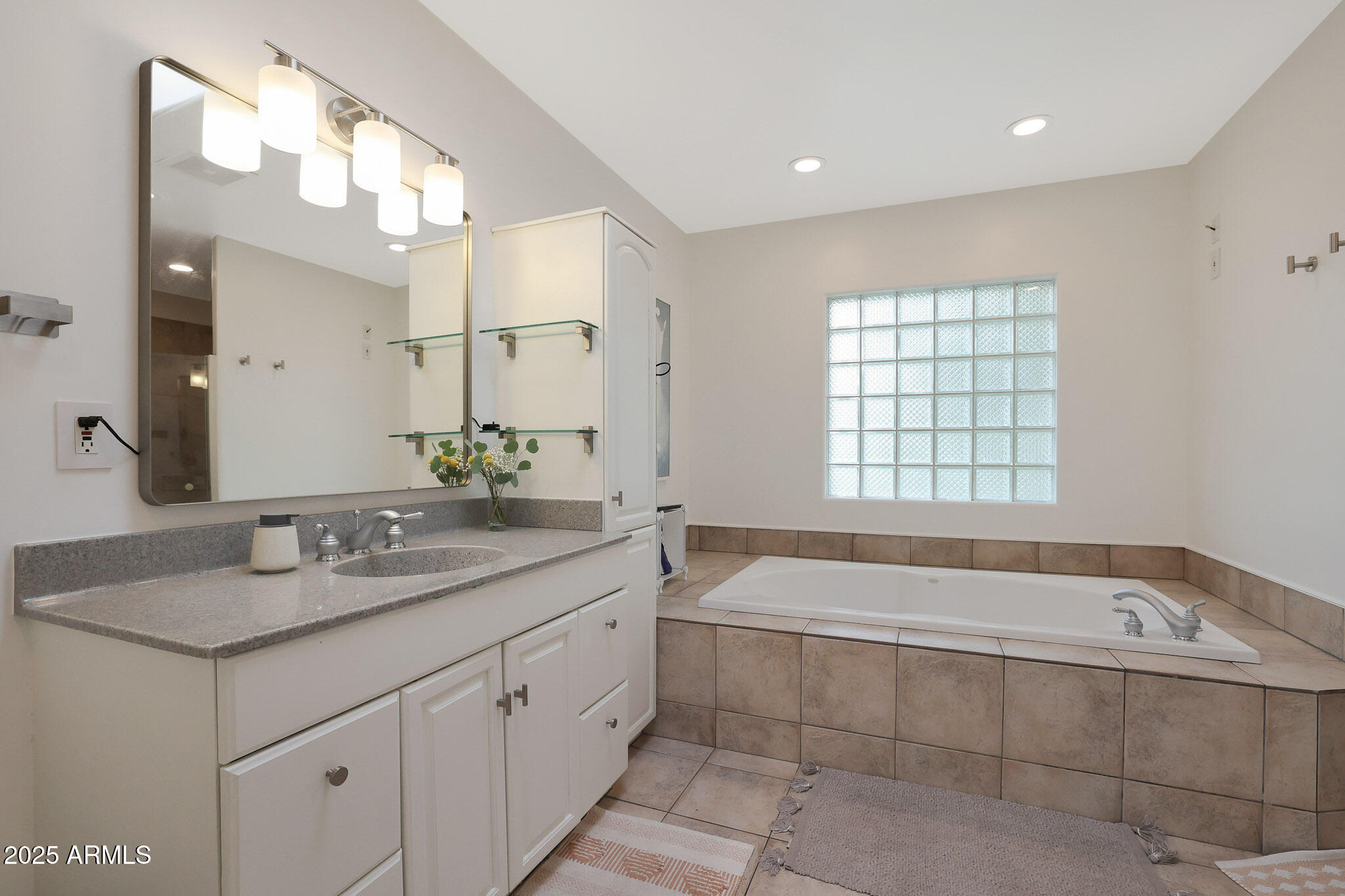 2226 East Fairmount Avenue Phoenix, AZ 85016 - Photo 28 of 50 a bathroom with a bathtub a double vanity sink and mirror