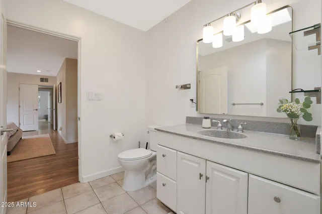 a bathroom with a tub a sink and shower