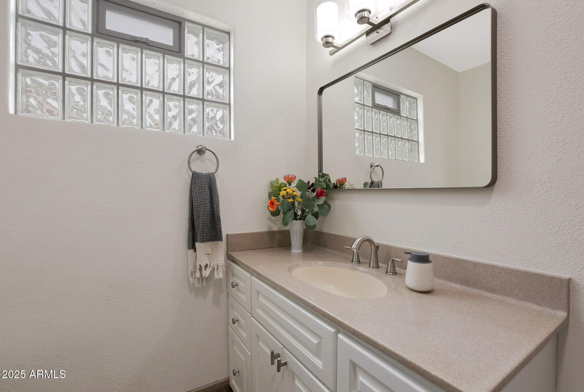 2226 East Fairmount Avenue Phoenix, AZ 85016 - Photo 40 of 50 a bathroom with a sink and a mirror