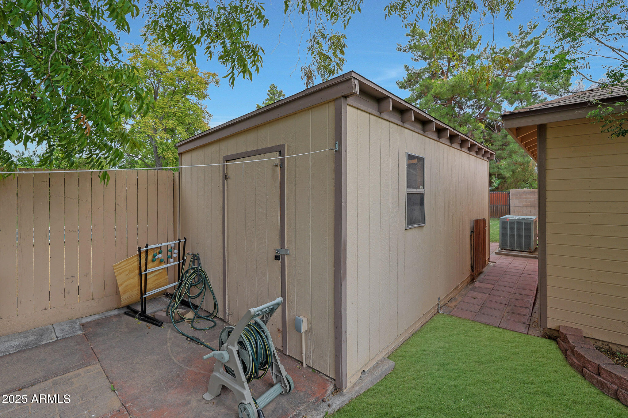 2226 East Fairmount Avenue Phoenix, AZ 85016 - Photo 50 of 50 a view of backyard with cabin and wooden fence