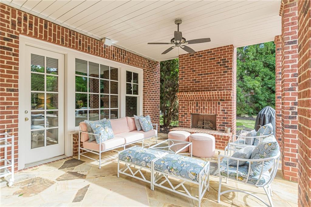 2010 Caladium Way Roswell, GA 30075 - Photo 61 of 71 a outdoor space with patio the couches and a dining table with the view of the balcony