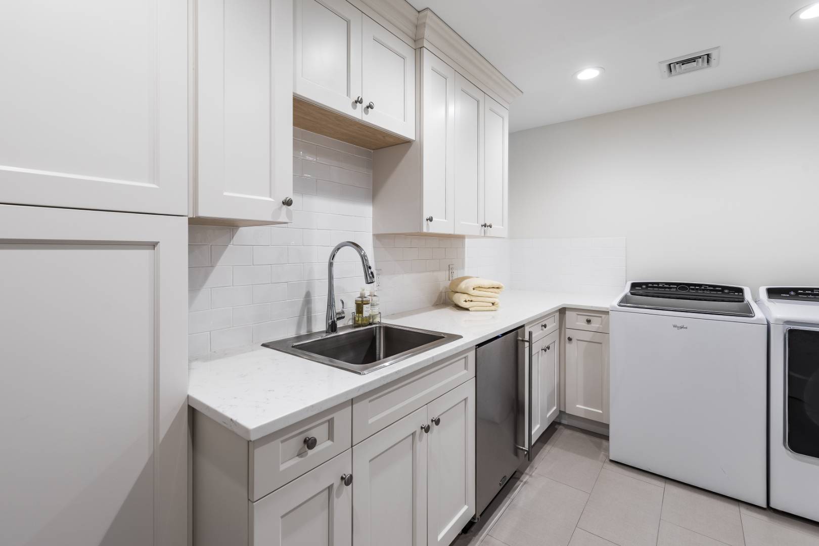 170 Scuttle Hole Road Water Mill, NY 11976 - Photo 19 of 35 a kitchen with appliances a sink and cabinets
