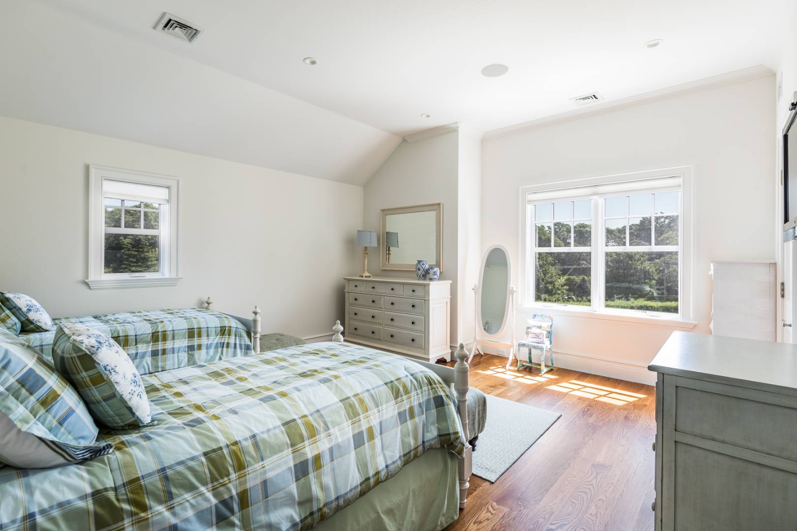 170 Scuttle Hole Road Water Mill, NY 11976 - Photo 20 of 35 a spacious bedroom with a large bed and a window