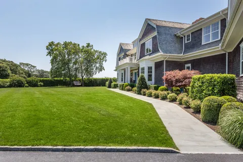 a front view of a house with garden